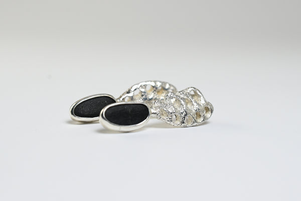 Silver earrings with rough seashore black stone. Handmade jewellery. 