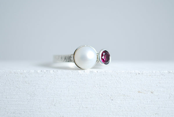 Silver ring with white pearl