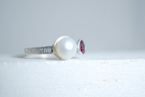 Silver ring with red garnet