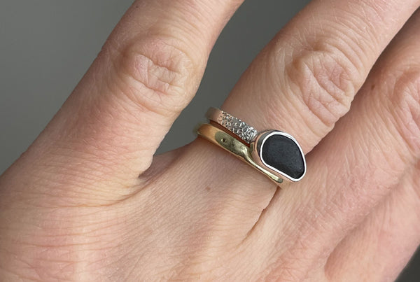 Handmade silver ring with black seaside stone