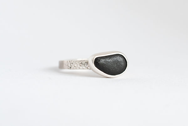 Handmade silver ring with black seaside stone