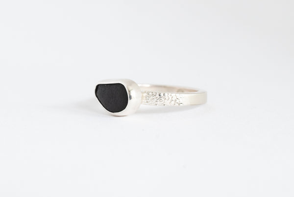 Handmade silver ring with black seaside stone