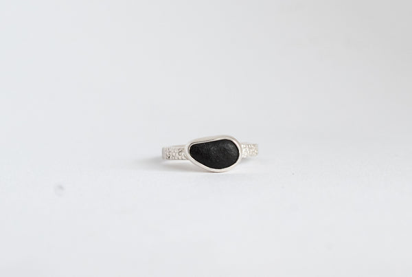 Handmade silver ring with black seaside stone